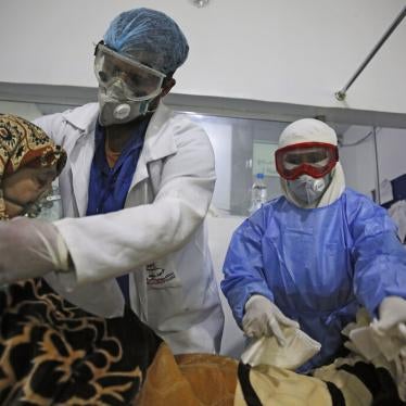 Medical workers attend to a Covid-19 patient in an intensive care unit at a hospital in Sanaa, Yemen, June 14, 2020.