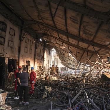 Members of the search team work at a burned down wedding hall after a fatal fire engulfed the hall during a wedding celebration, September 27, 2023. 